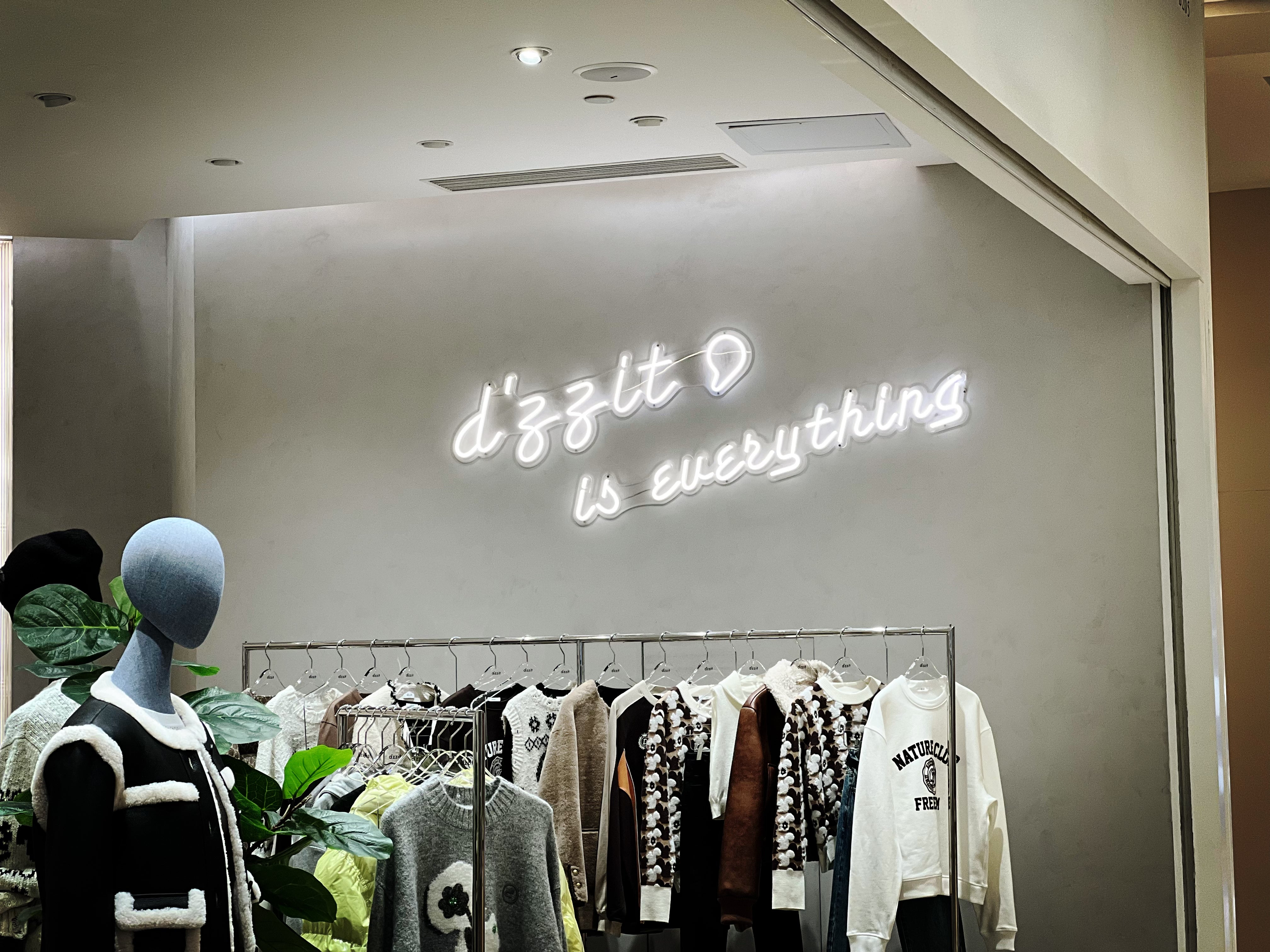 SHOW CASE | White neon sign for IGC MiuMiu women's clothing retail store
