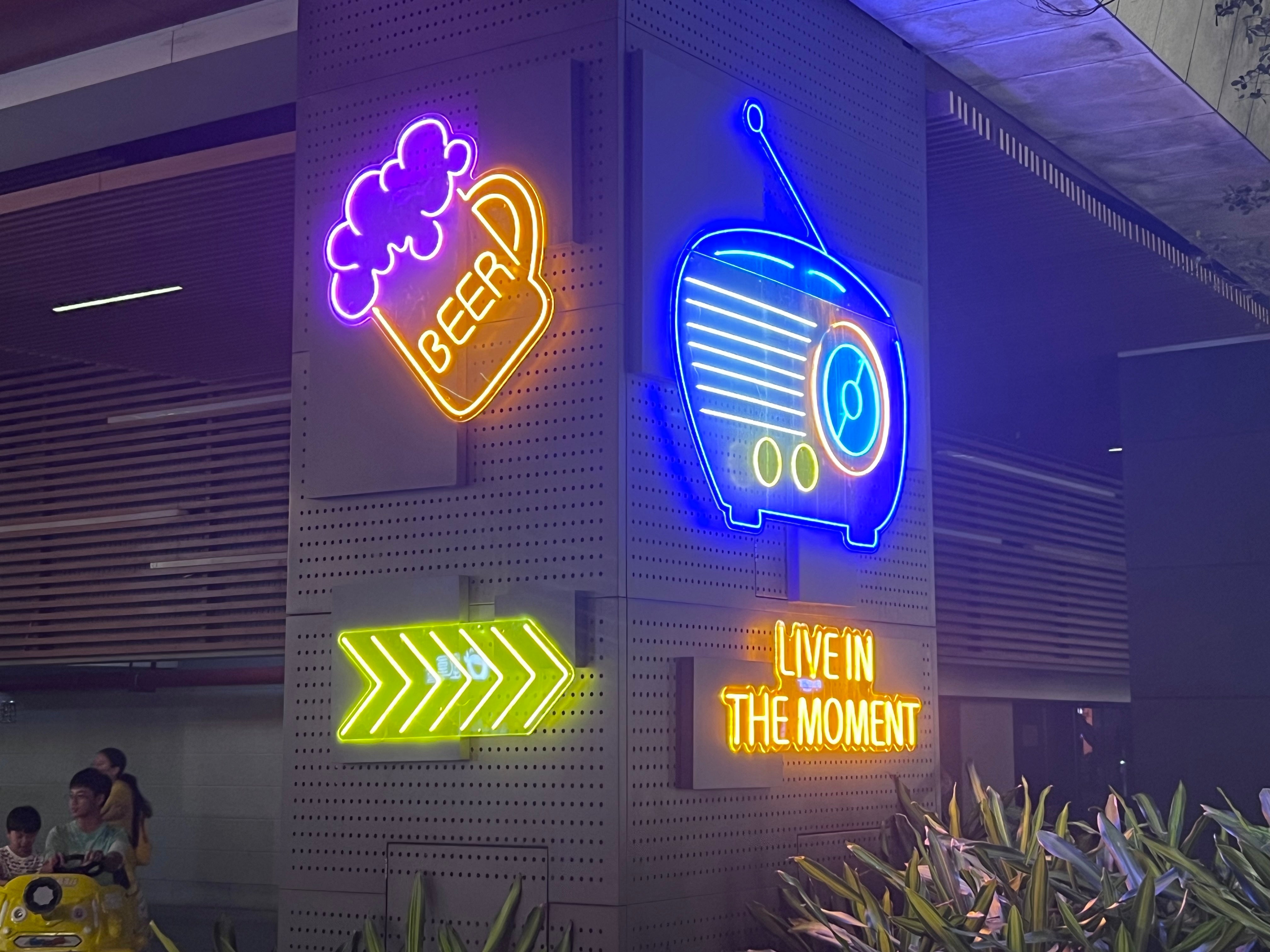 SHOW CASE | SPACE plus bar blue neon sign hanging in the bar