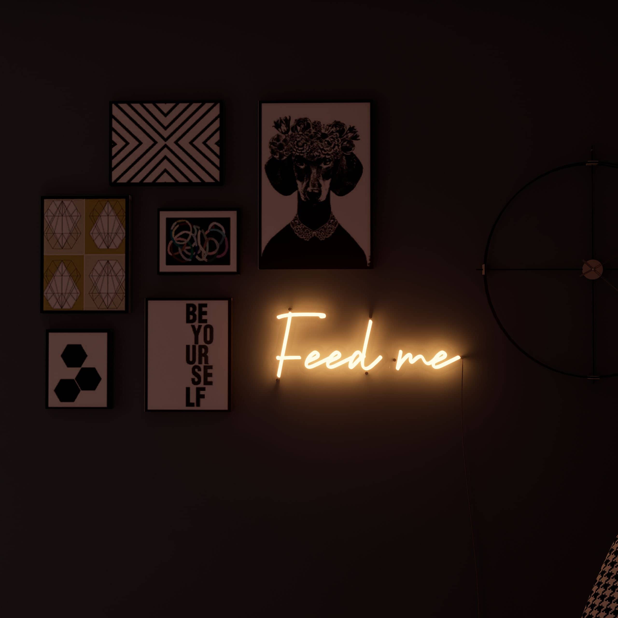 Vibrant Feed Me sign lights up bedrooms.