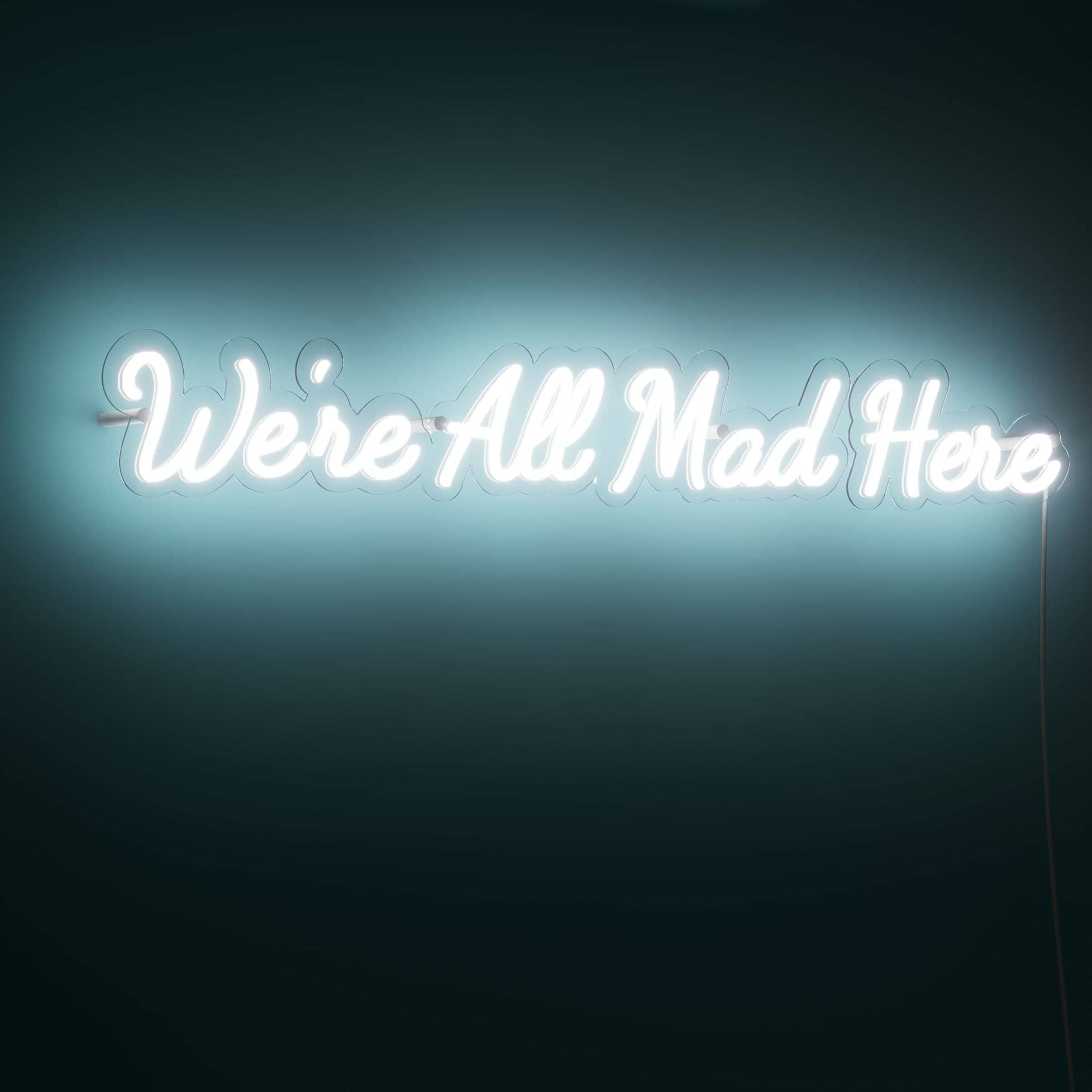 We're All Mad Here bedroom neon sign in vibrant pink