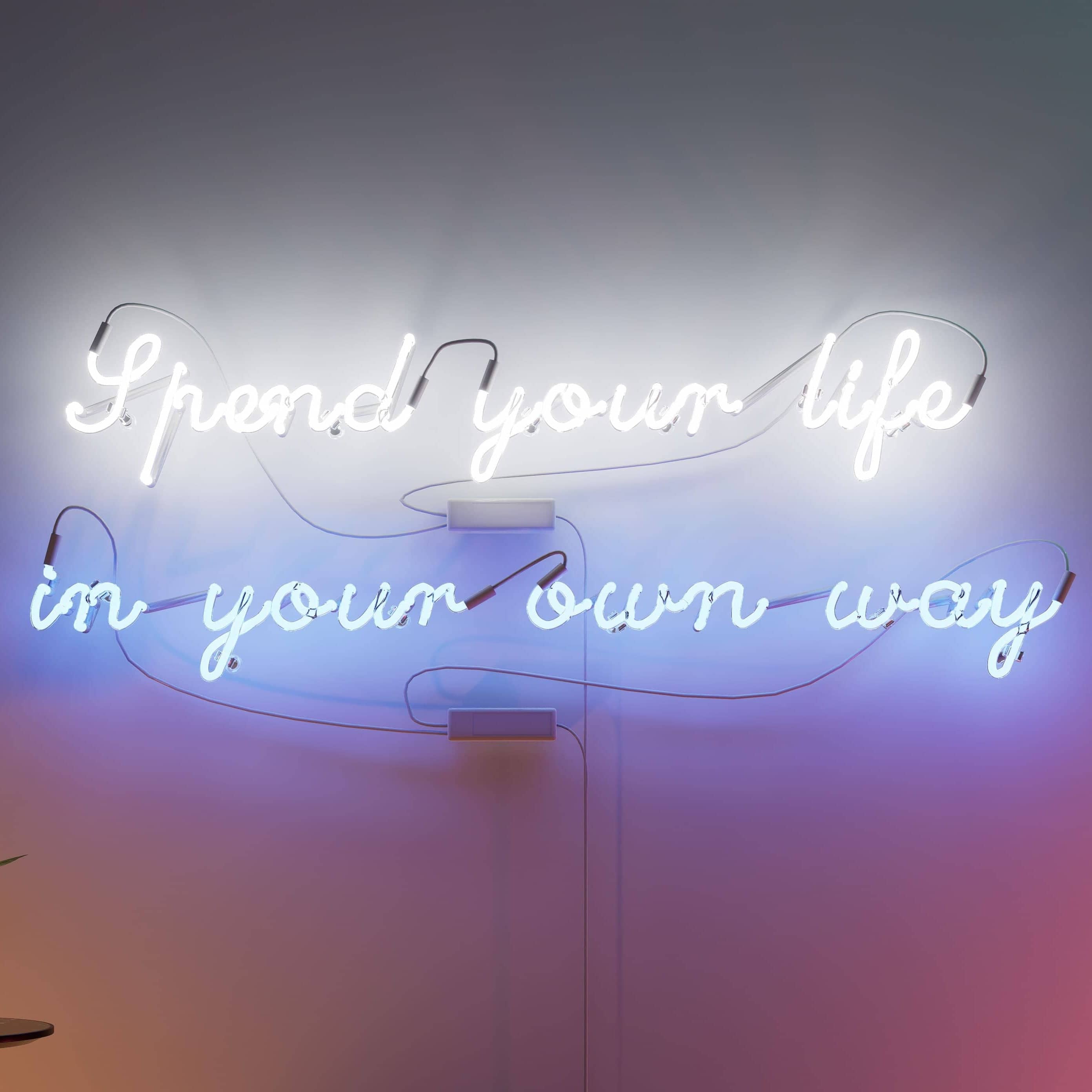 Glass Neon Sign displaying Spend your life in your own way in vibrant colors