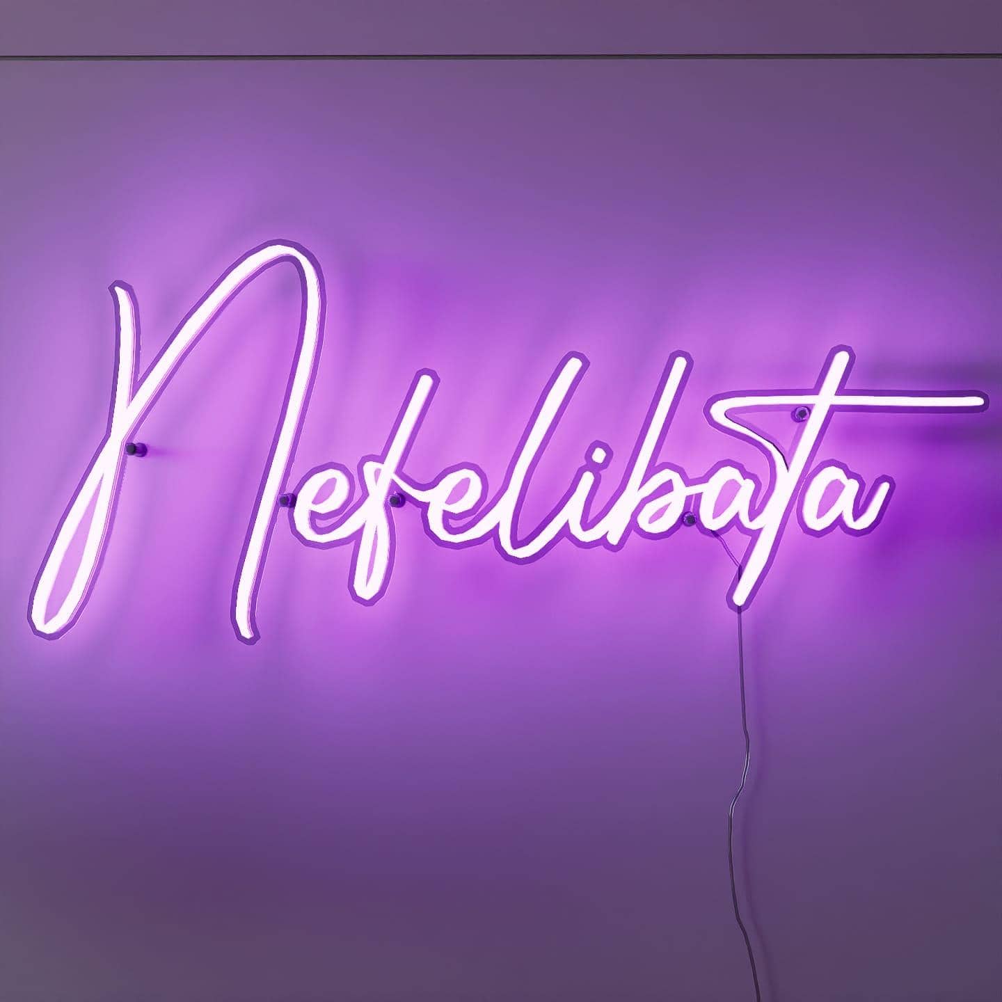 shot-of-lit-purple-neon-lights-hanging-on-the-wall