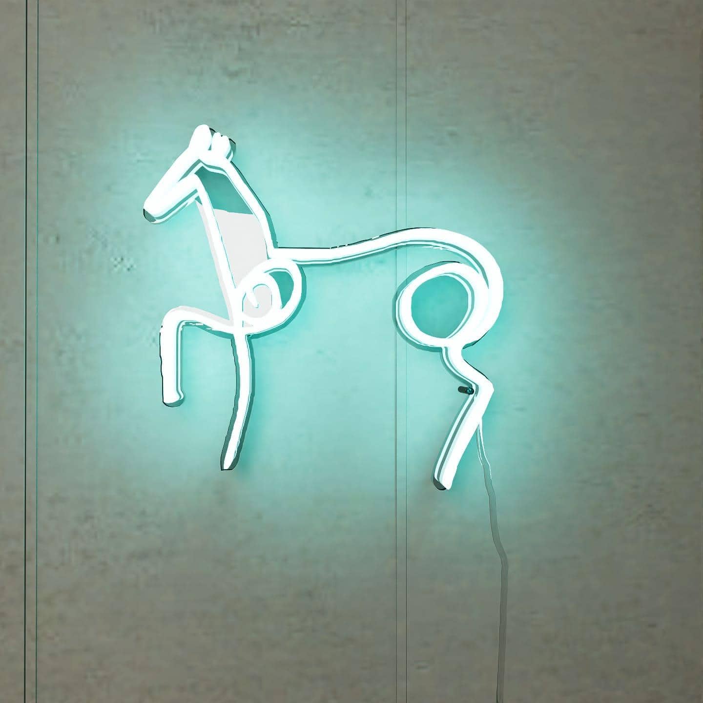 lighted-at-night-picasso-sketch-horse-hanging-on-wall-display-light-blue