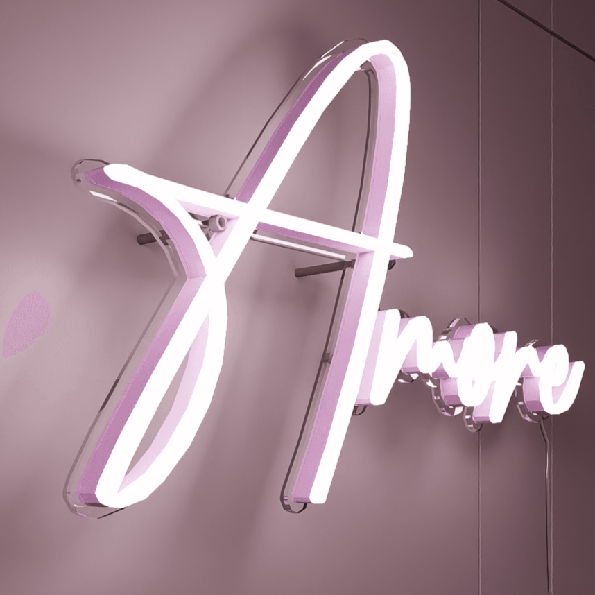 the word 'amore' placed under a neon-lit archway, creating a stunning entryway or photo backdrop for the wedding.