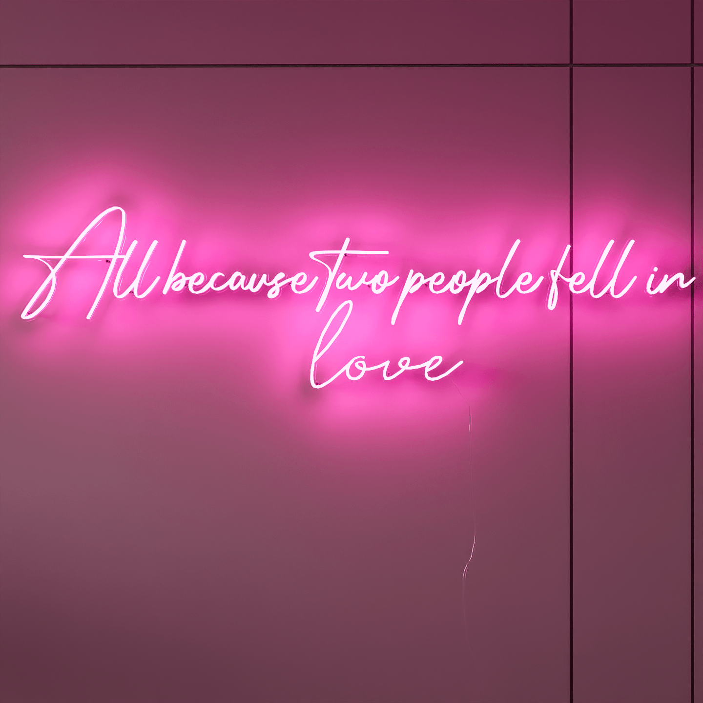 Custom wedding neon signs showing All Because Two People Fell in Love in bright lights.