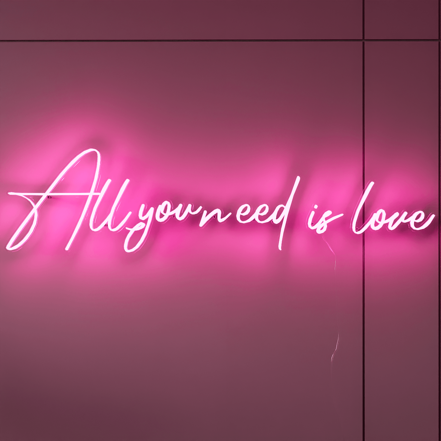 Custom neon wedding sign with All You Need Is Love in bright lights