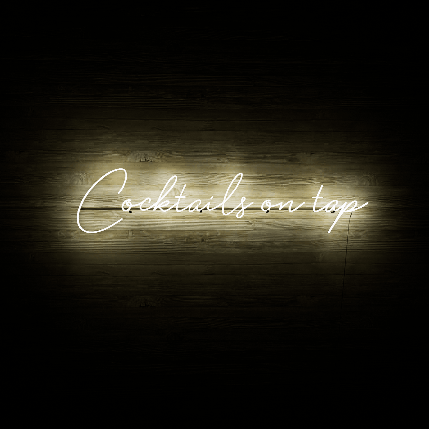 frontal-shot-of-illuminated-white-neon-lights-hanging-on-the-wall-at-night-cocktails-on-tap