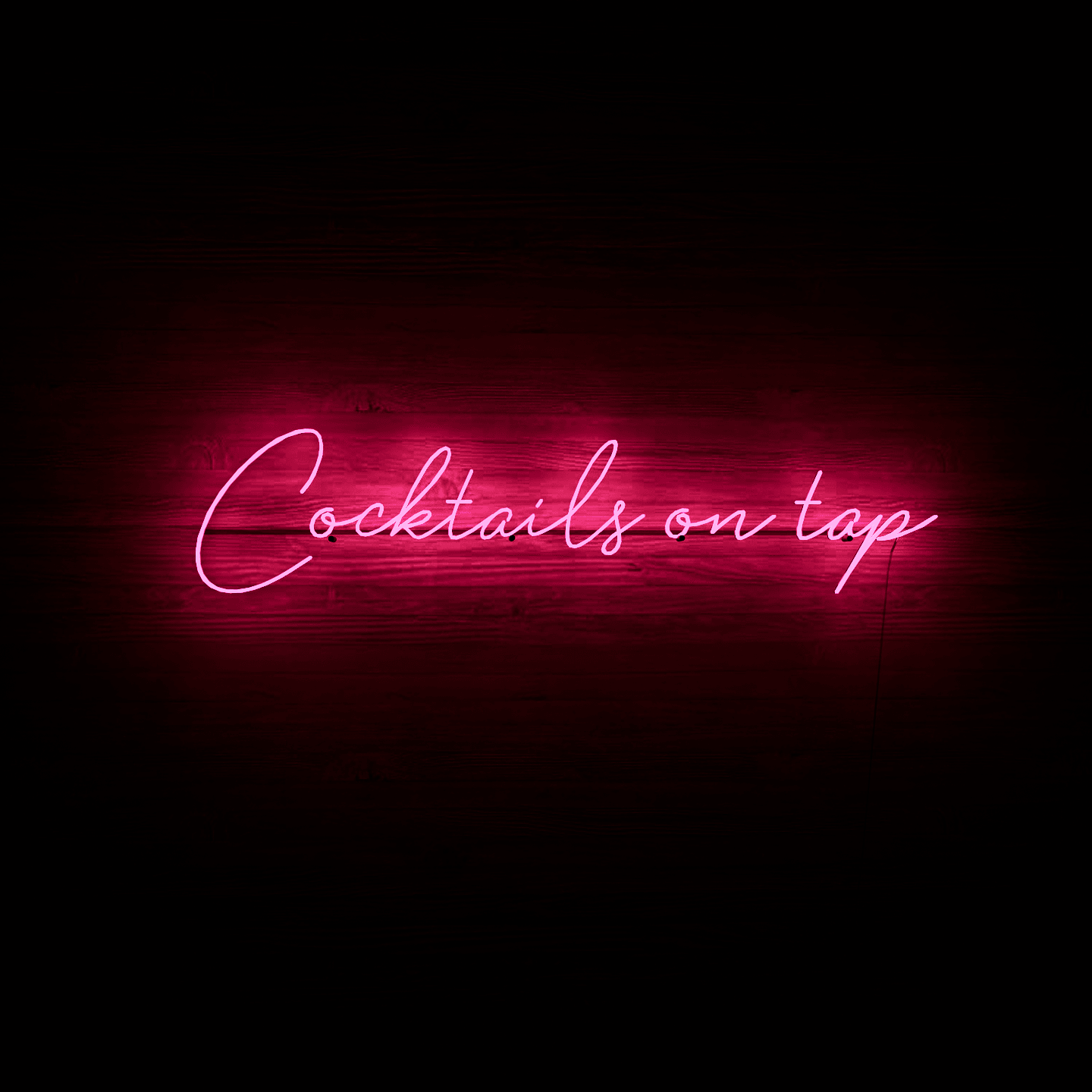 frontal-shot-of-lit-pink-neon-lights-hanging-on-the-wall-at-night-cocktails-on-tap