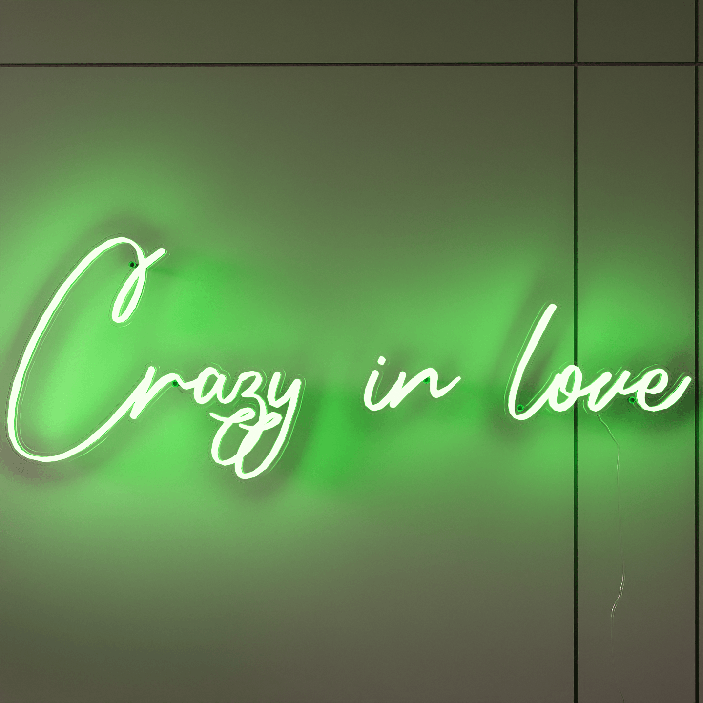 frontal-shot-of-lit-green-neon-lights-hanging-on-wall-for-display-crazy-in-love