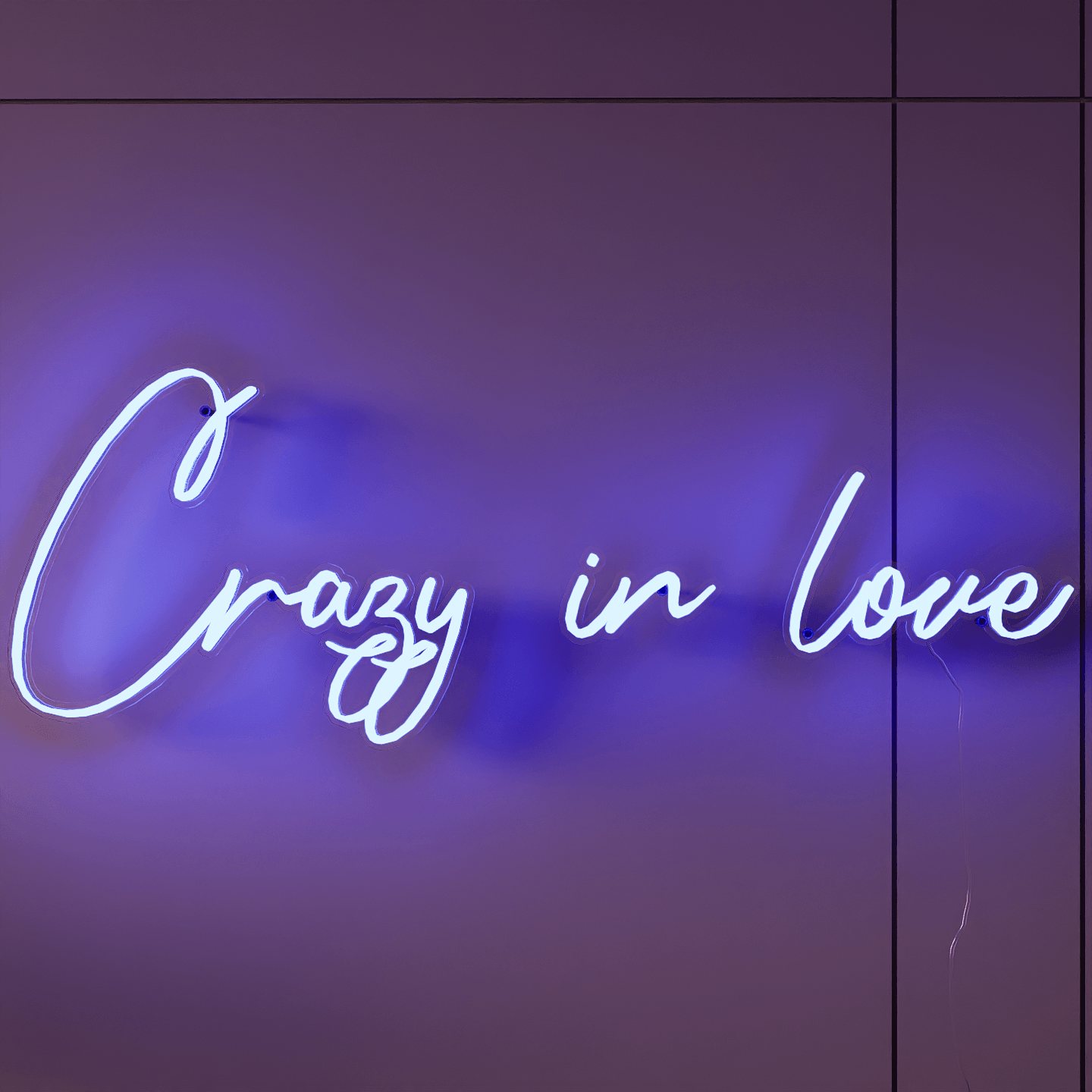 frontal-shot-of-lit-blue-neon-lights-hanging-on-wall-for-display-crazy-in-love