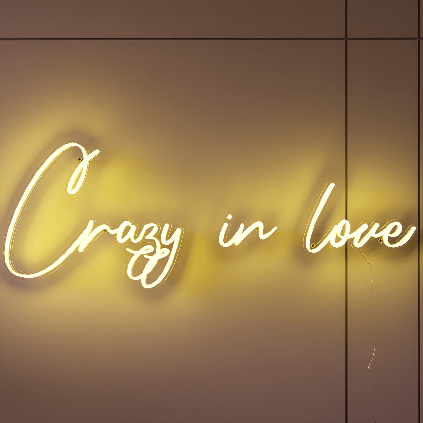 frontal-shot-of-lit-yellow-neon-lights-hanging-on-the-wall-for-display-crazy-in-love