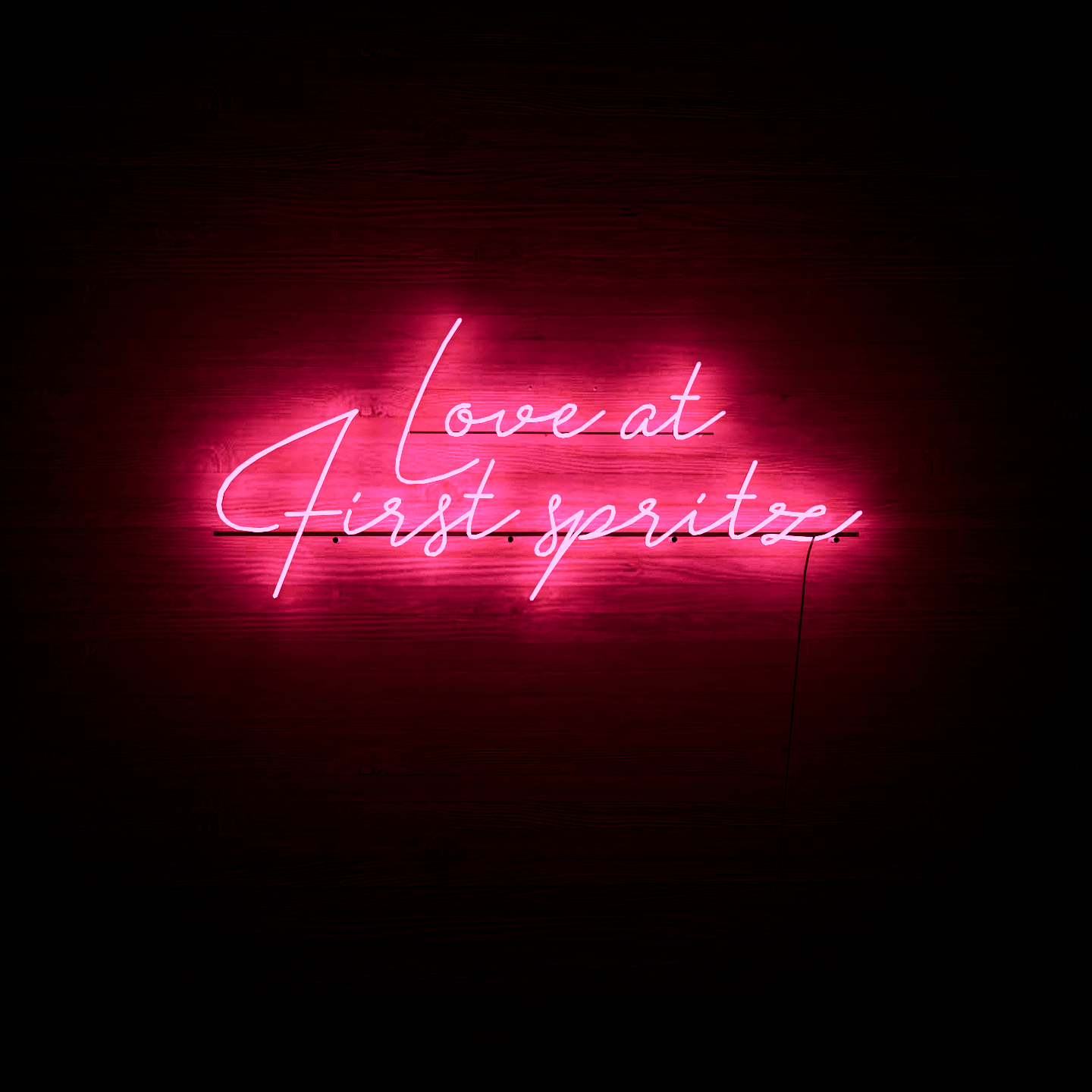dark-night-lit-pink-neon-lights-hanging-on-the-wall-for-display-love-at-first-spritz