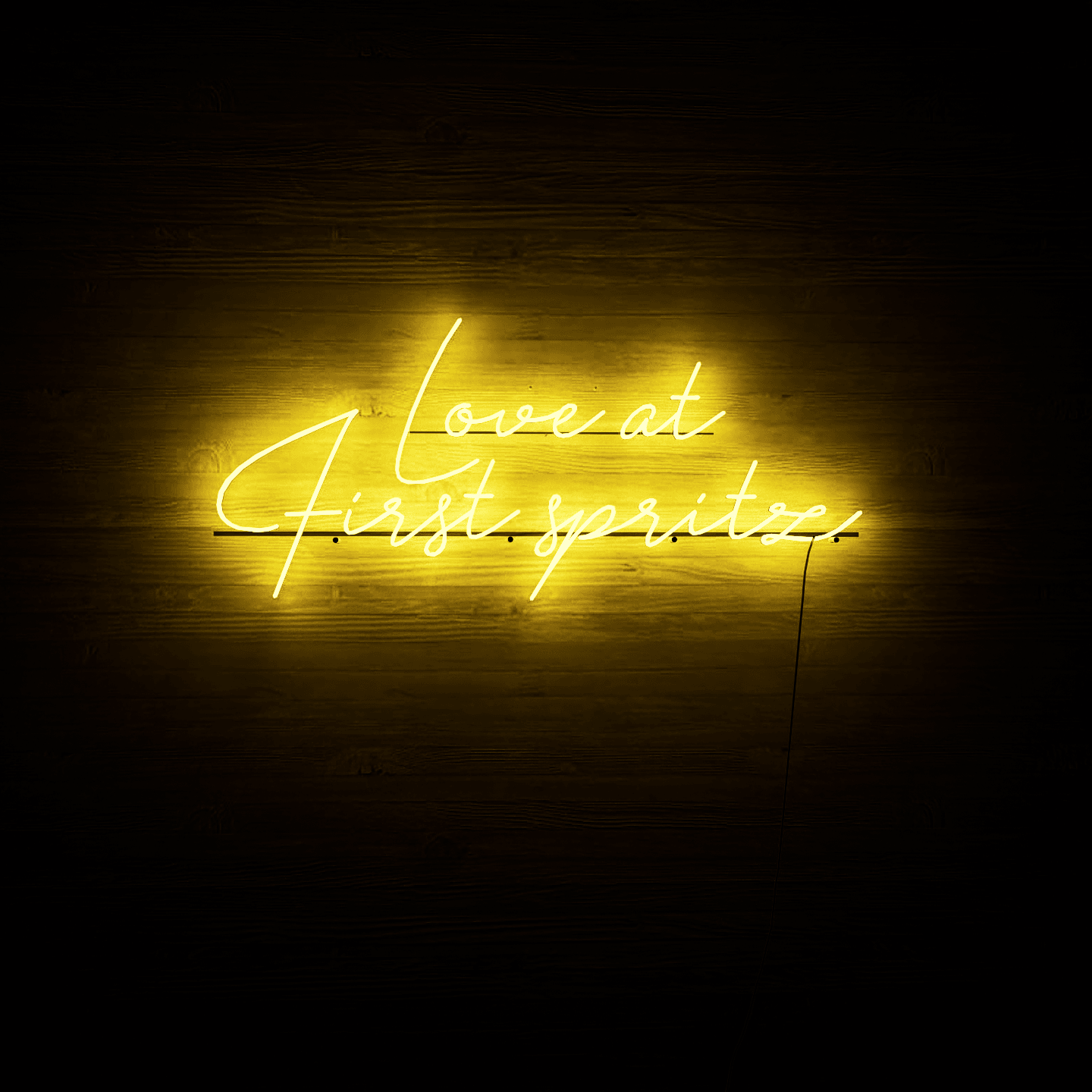 dark-night-lit-yellow-neon-lights-hanging-on-the-wall-for-display-love-at-first-spritz