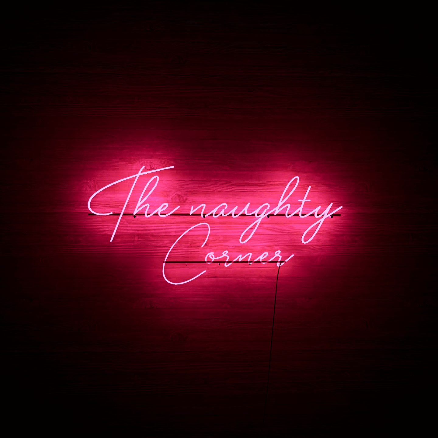 Dark night lit pink neon lights hanging on the wall-The Naughty Corner