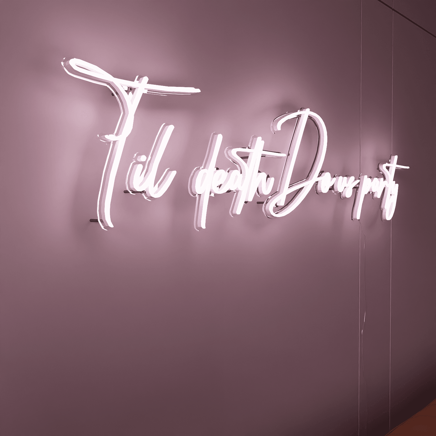 side-shot-of-illuminated-white-neon-sign-hanging-on-the-wall-at-night-til-death-do-us-party