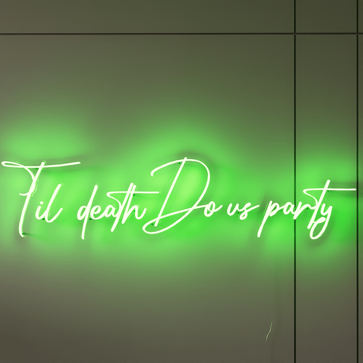 frontal-shot-of-illuminated-green-neon-sign-hanging-on-the-wall-at-night-til-death-do-us-party