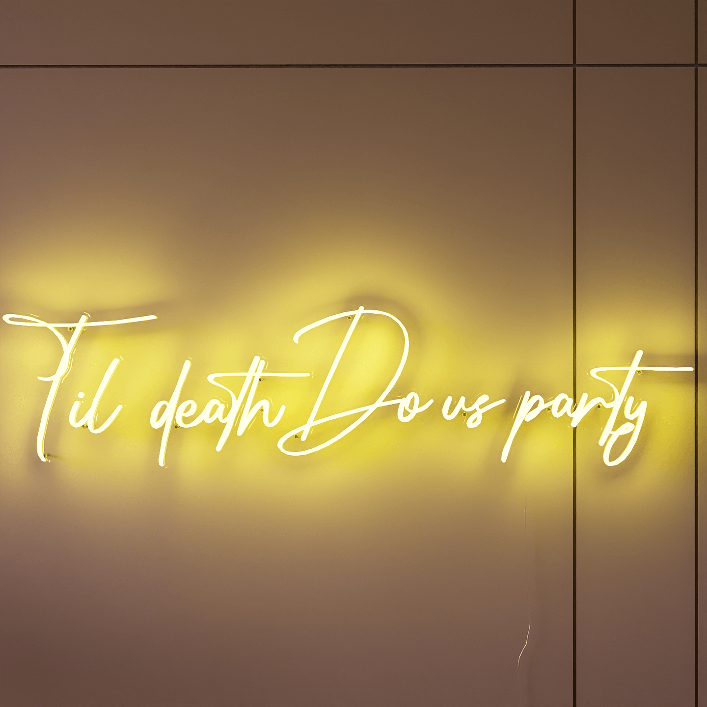 frontal-shot-of-yellow-neon-sign-lit-on-the-wall-at-night-til-death-do-us-party