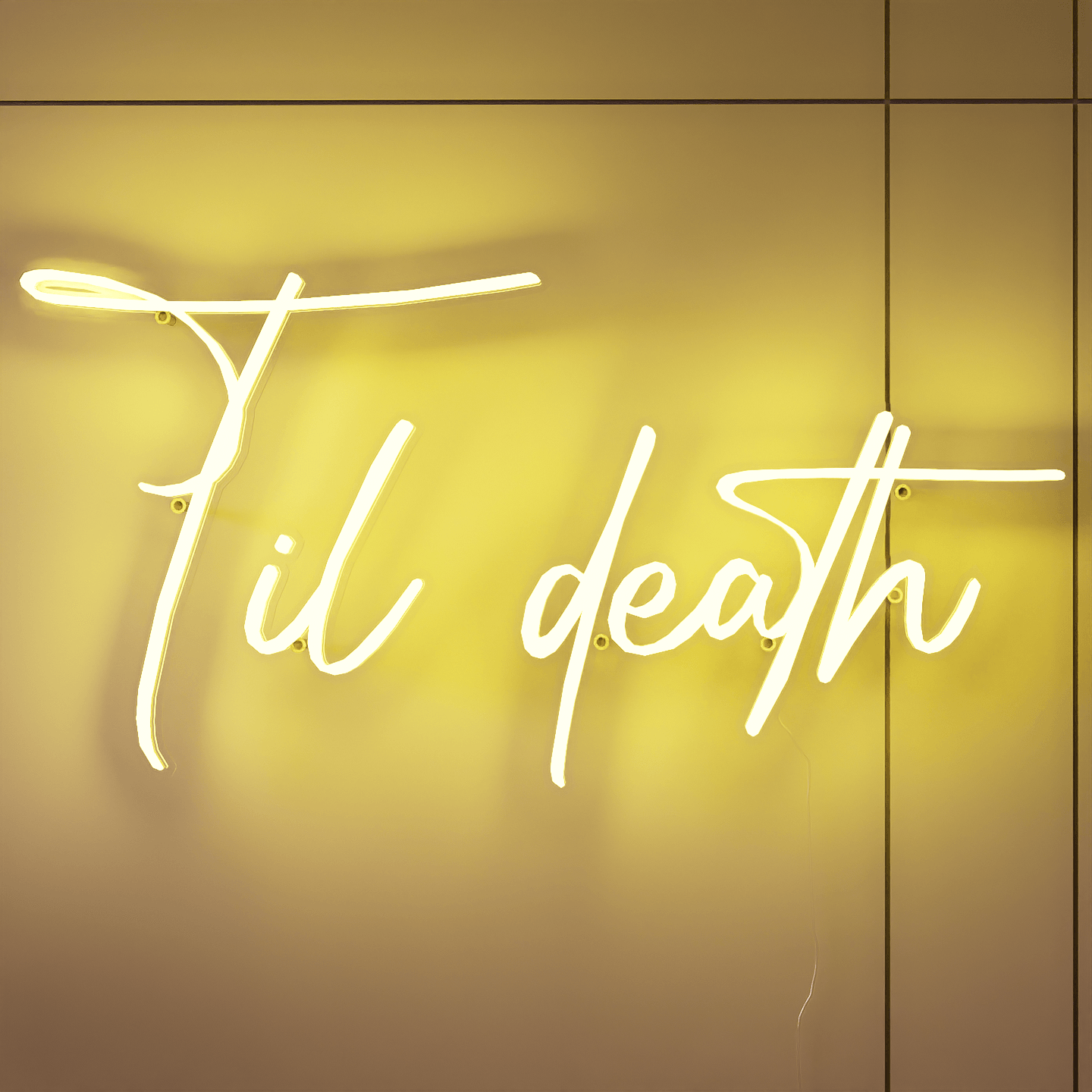 frontal-shot-of-yellow-neon-lights-lit-up-at-night-and-hung-on-the-wall-for-display-til-death