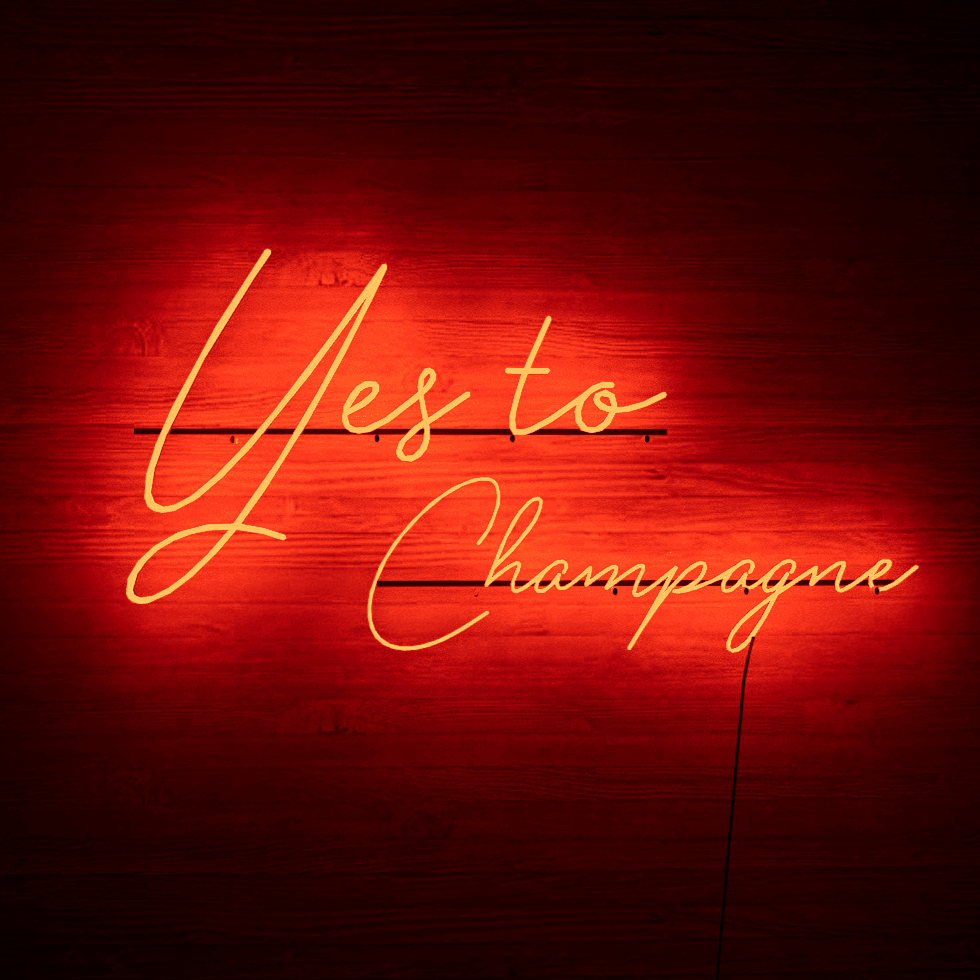 light-up-red-neon-light-hanging-on-wall-yes-to-champagne