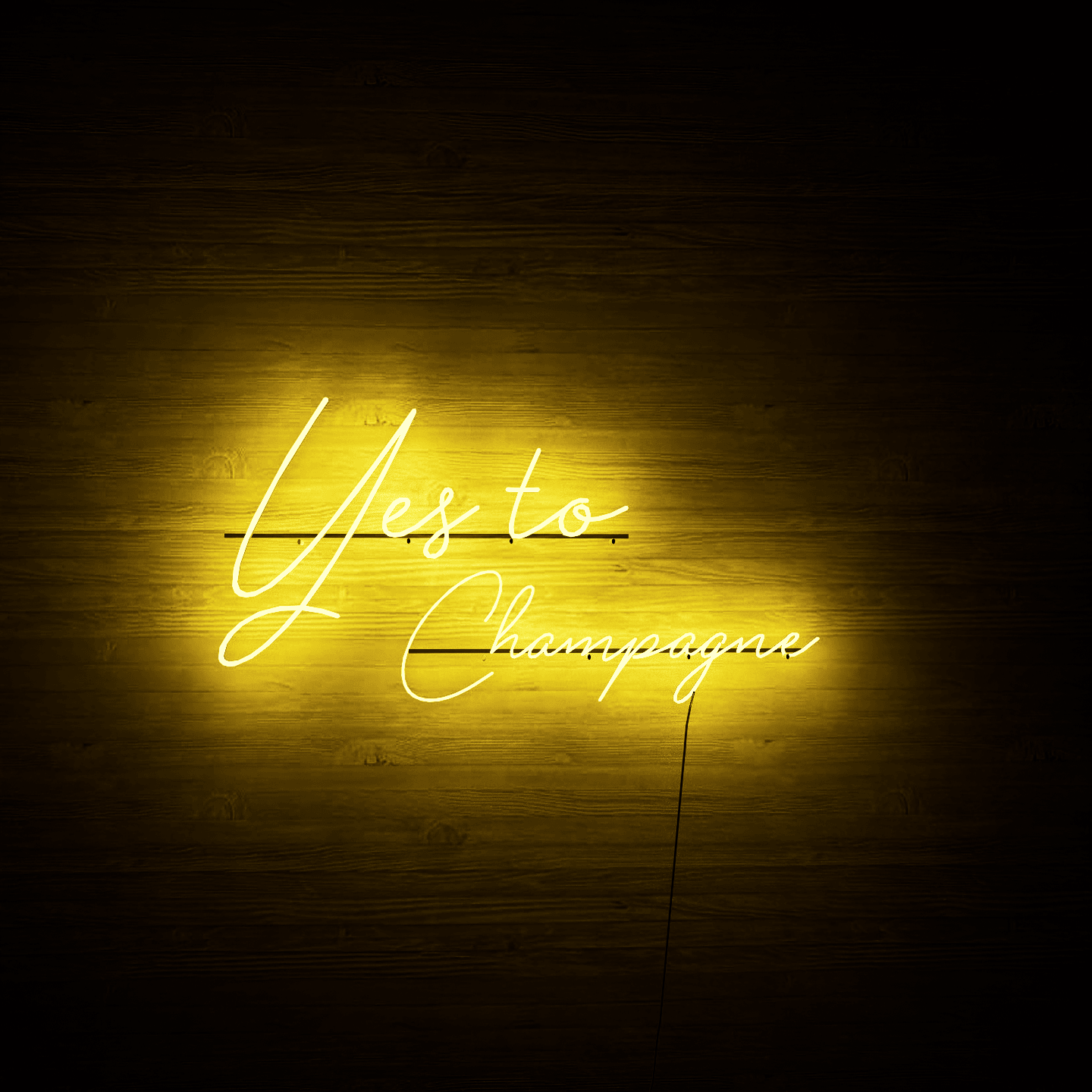 Light yellow neon light hanging on wall-Yes to Champagne