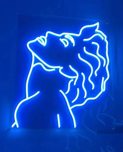 How do neon lights and signs work, and why are they so popular in modern design, advertising, and cityscapes?