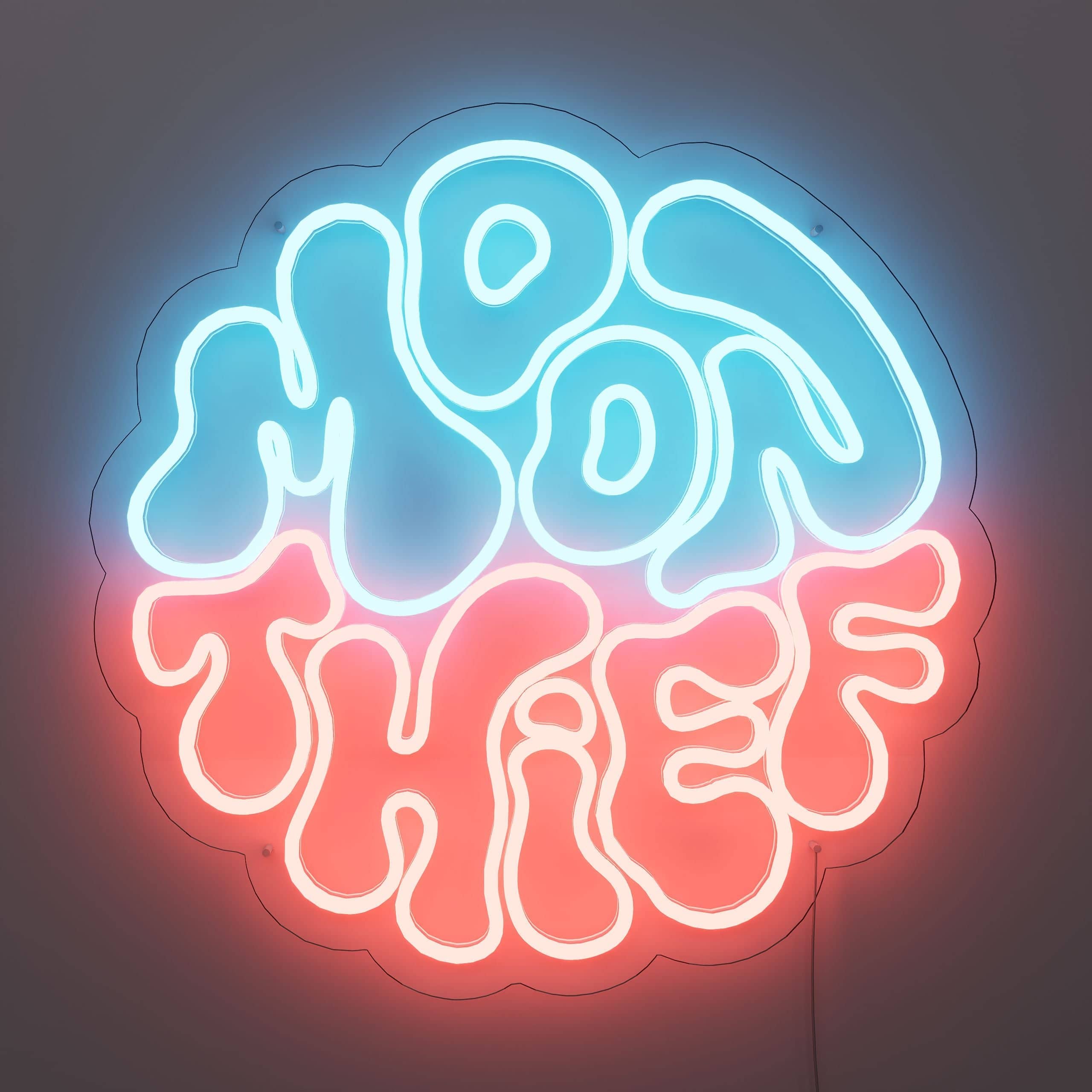 Moon Thief Neon Sign casts a pink glow in living rooms
