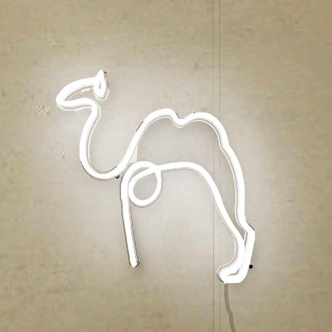 An abstract neon sign featuring a camel in a vibrant orange hue.