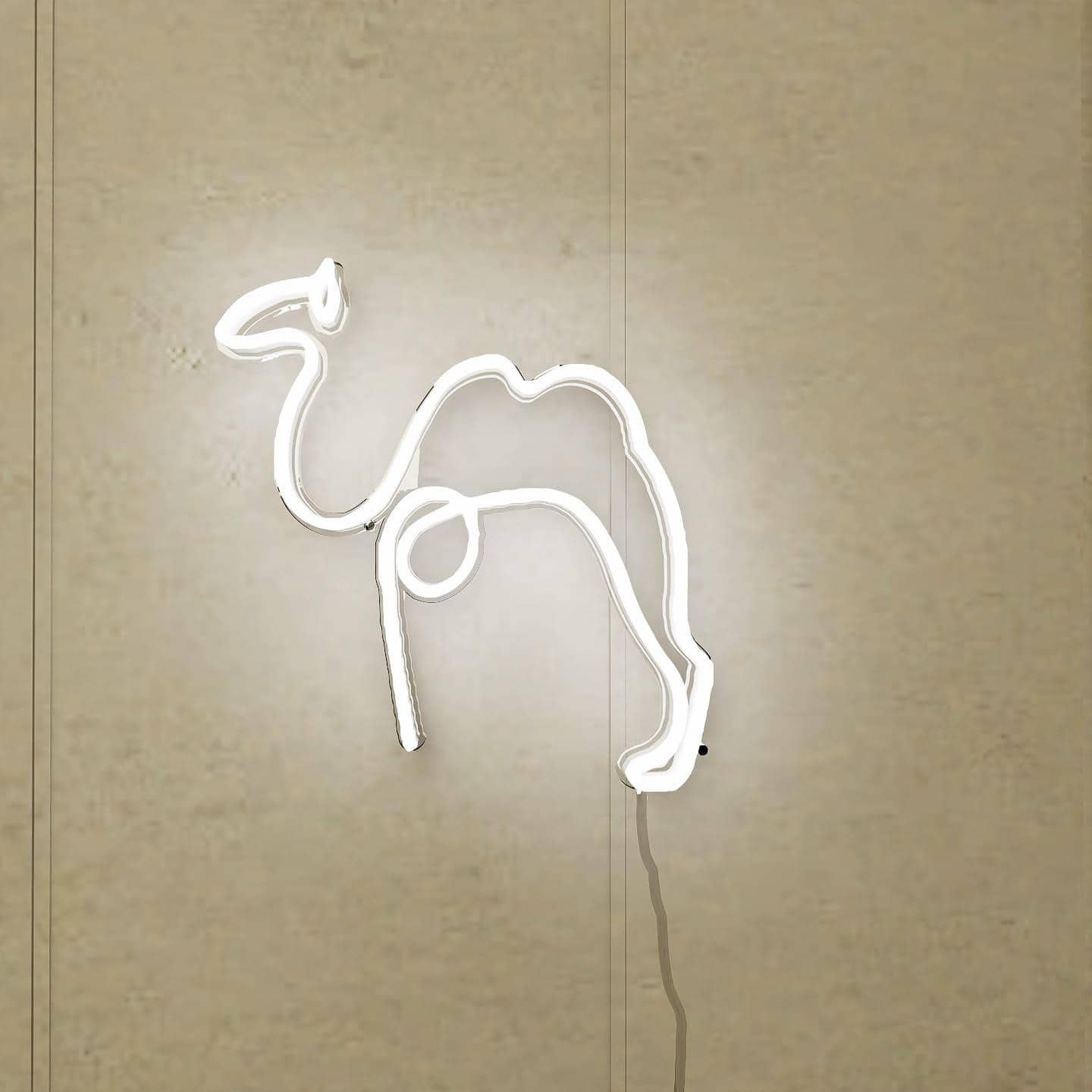 An abstract neon sign featuring a camel in a vibrant orange hue.