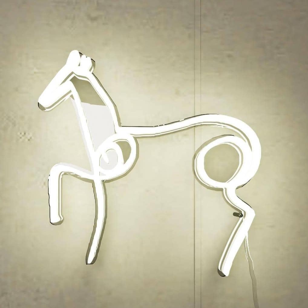 lighted-at-night-picasso-sketch-horse-hanging-on-wall-display-white