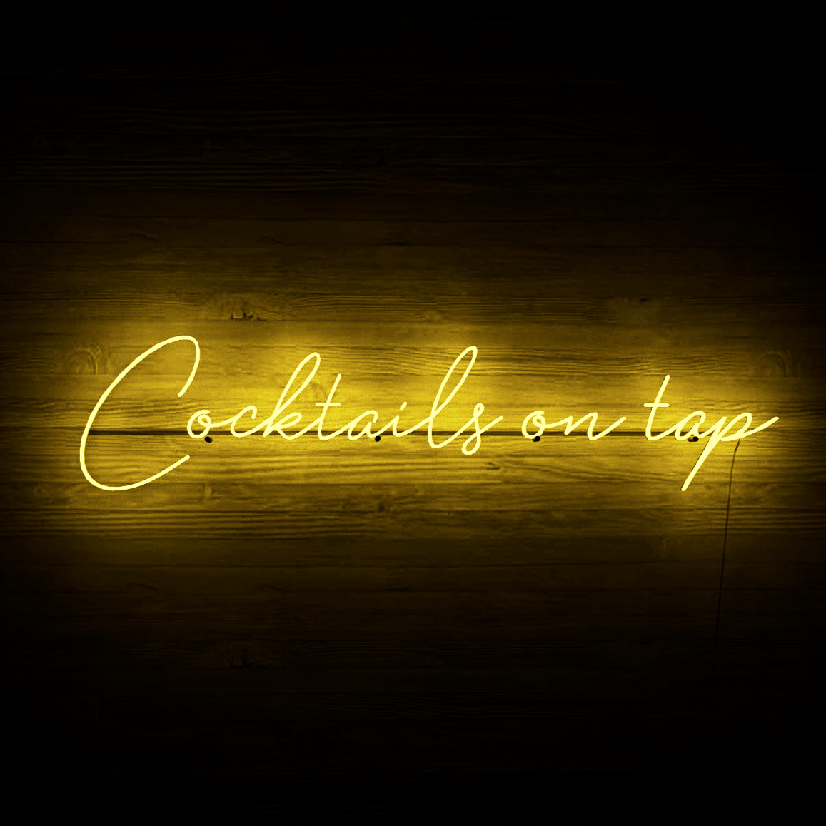 frontal-shot-of-yellow-neon-lights-lit-on-the-wall-at-night-cocktails-on-tap