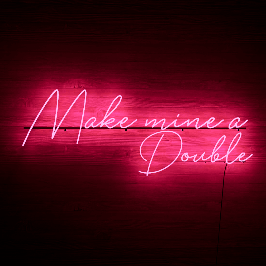 dark-night-lit-pink-neon-lights-hanging-on-wall-for-display