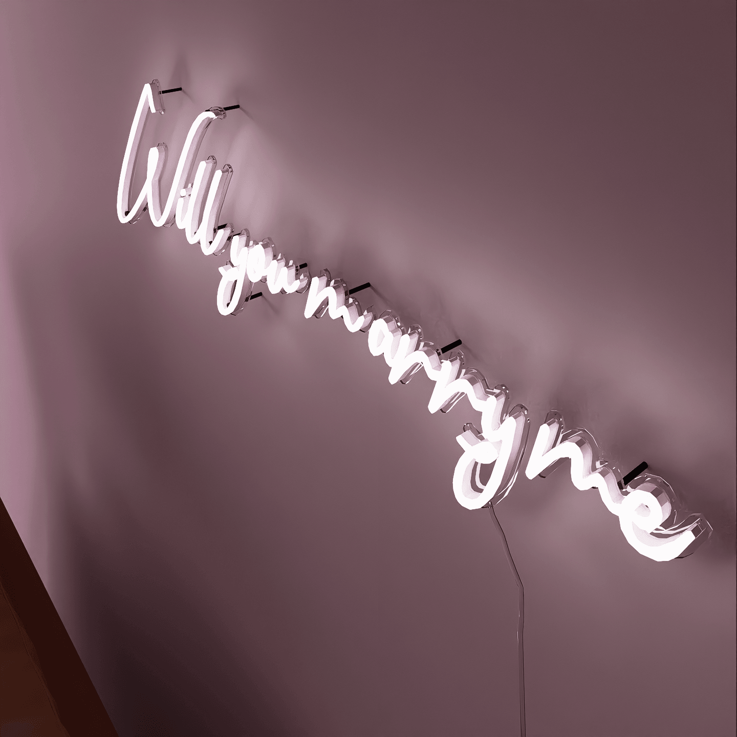 oblique-shot-of-lit-white-neon-lights-hanging-on-the-wall-will-you-marry-me