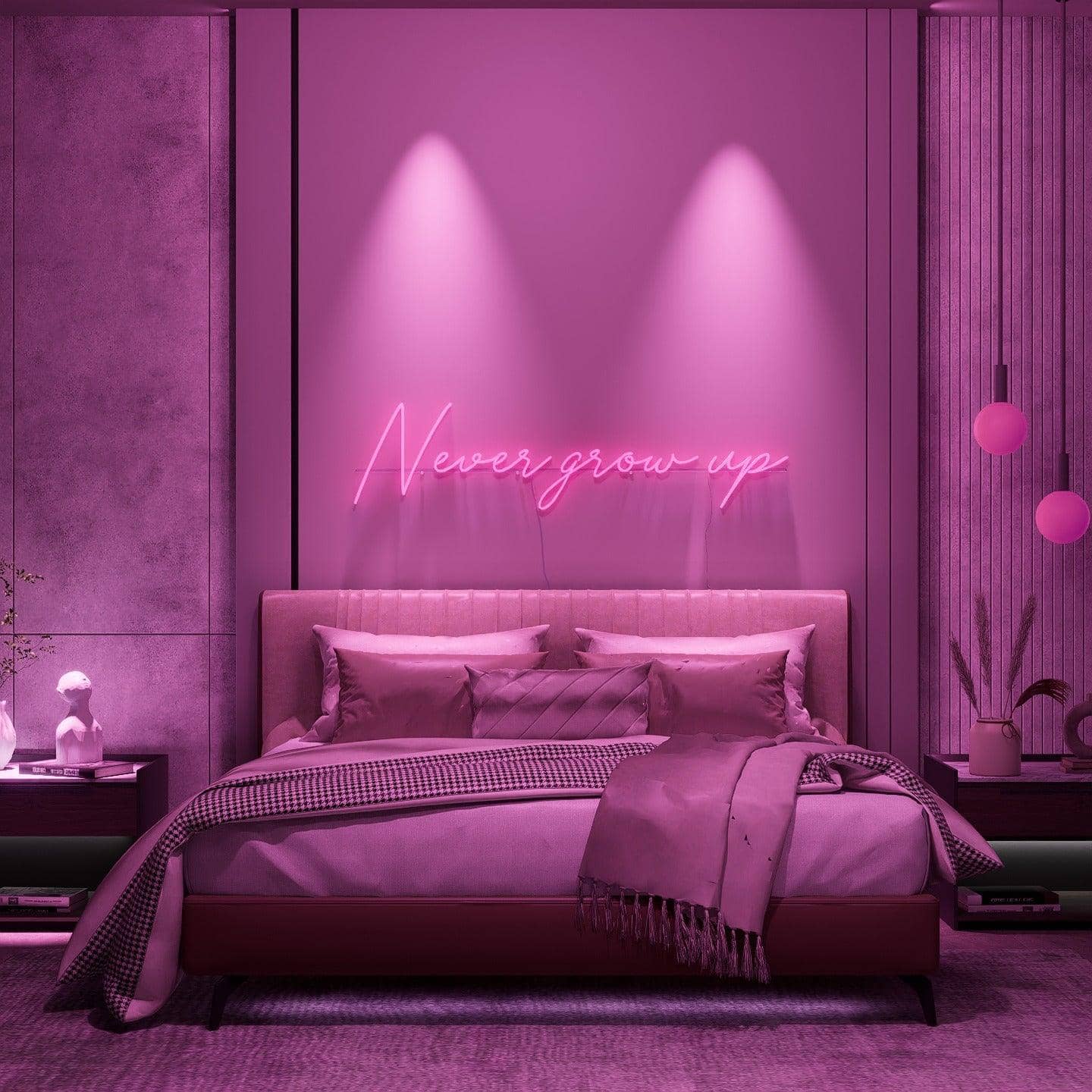 dark-night-lit-pink-neon-lights-hanging-on-the-wall-for-display-never-grow-up