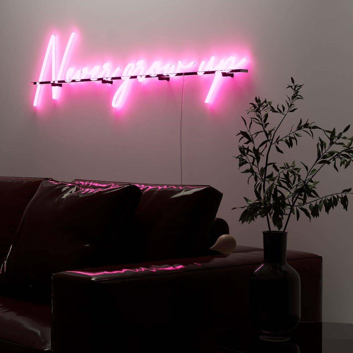 dark-night-lit-pink-neon-lights-hanging-on-the-wall-for-display-never-grow-up