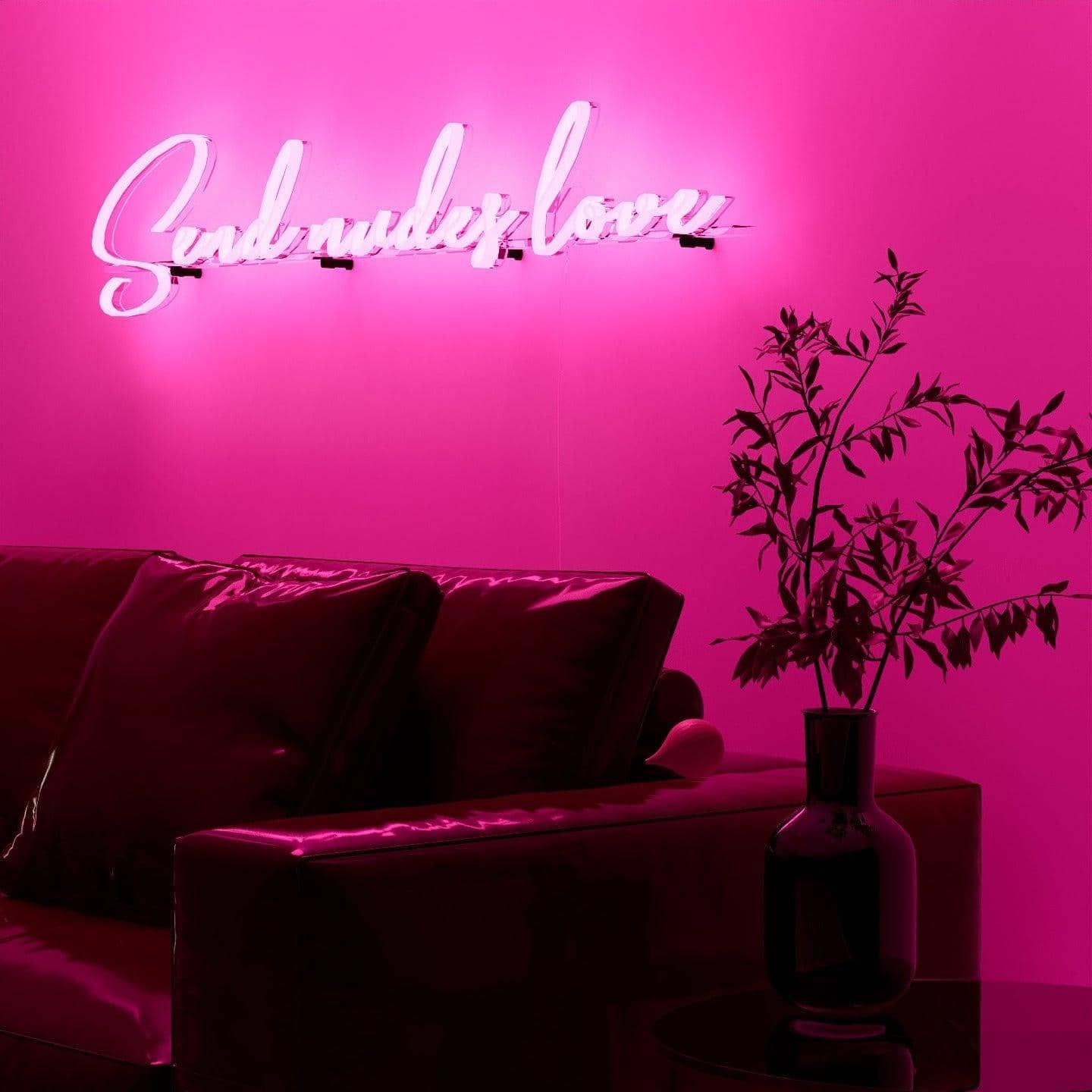 dark-night-lit-pink-neon-lights-hanging-on-the-wall-for-display-send-nudes-love