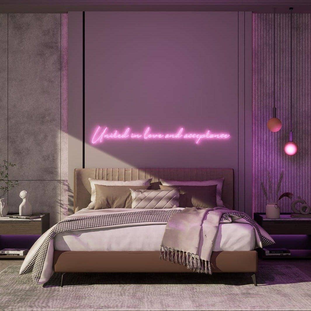 light-up-pink-neon-lights-hanging-on-the-wall-during-the-day-united-in-love-and-acceptance