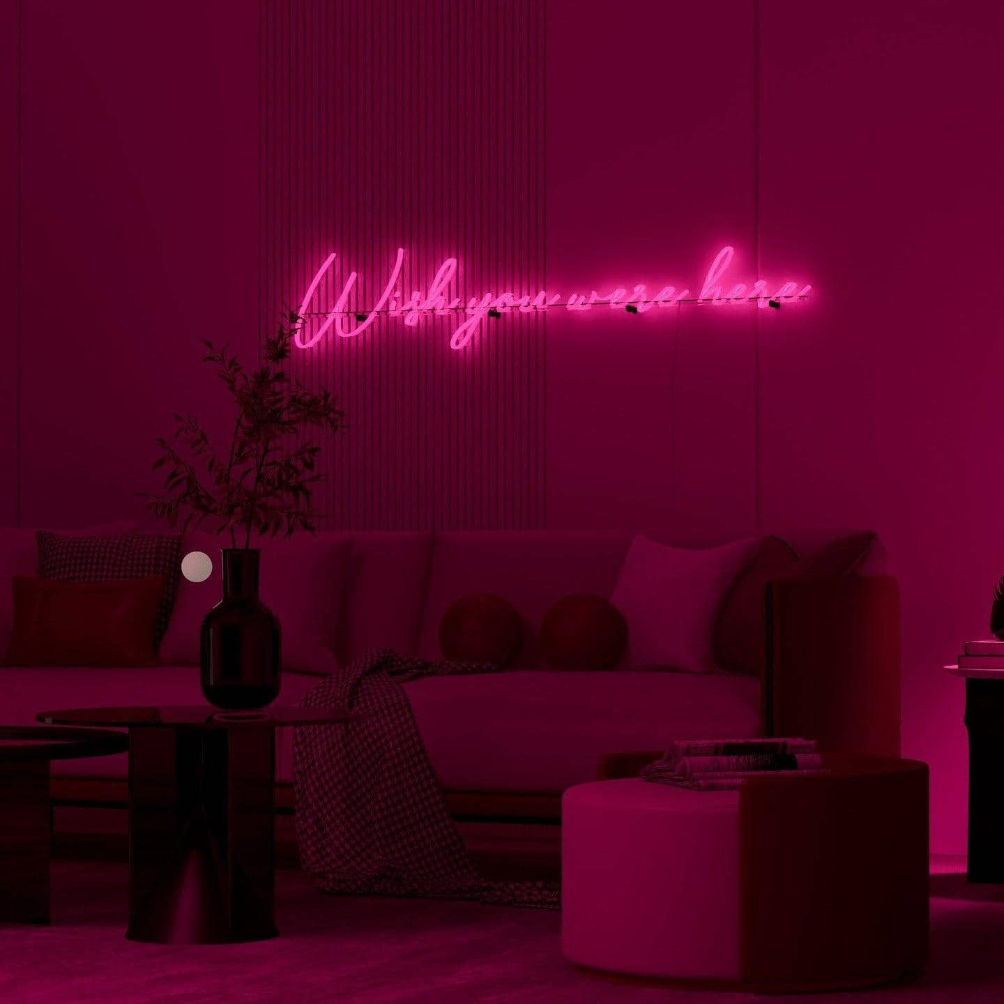 light-up-pink-neon-lights-hanging-on-wall-at-night-wish-you-were-here